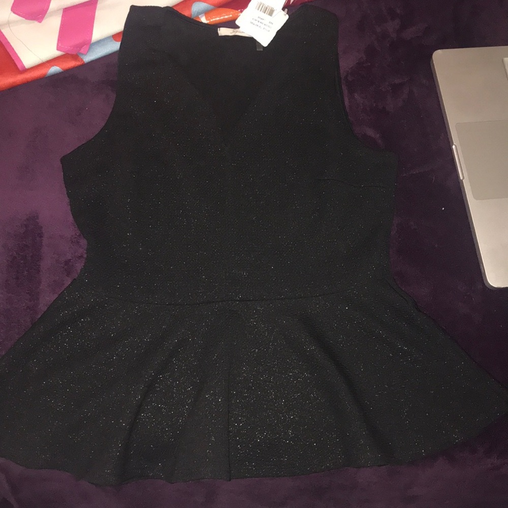 Black peplum top with gold shimmer